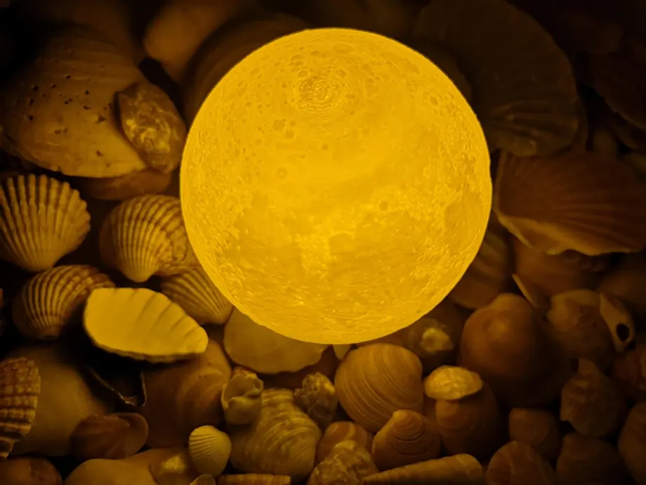 A glowing moon relief lamp