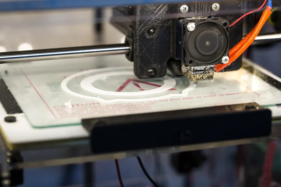 Close-up of a 3D printer printing a component